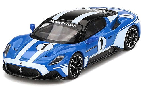 A 1/64 scale diecast model of a blue Maserati MC20 with white stripes and black top, number 1 on the side.