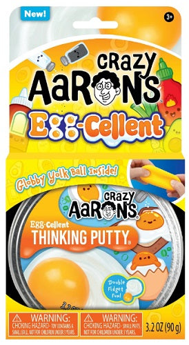 Egg themed characters on package of white slime with stretchy yellow "yolk" ball.