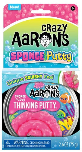 Packaging for pink putty with a picture of an underwater scene.