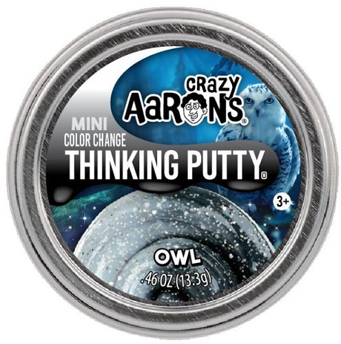 Round metal tin with picture of an owl and light gray to dark grade gradiant putty.