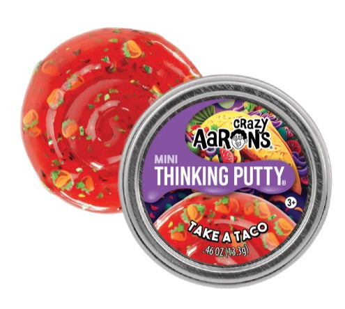 Round metal tin of red putty with taco shaped piecesand small metallic flakes.