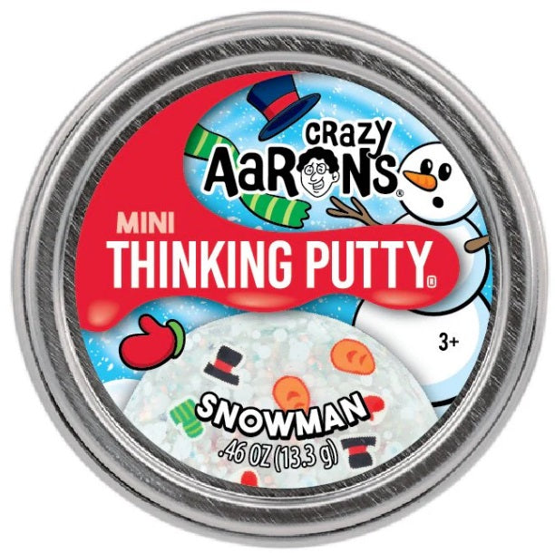 Round metal tin of white putty with carrot, top hat, and scarf shaped pieces.