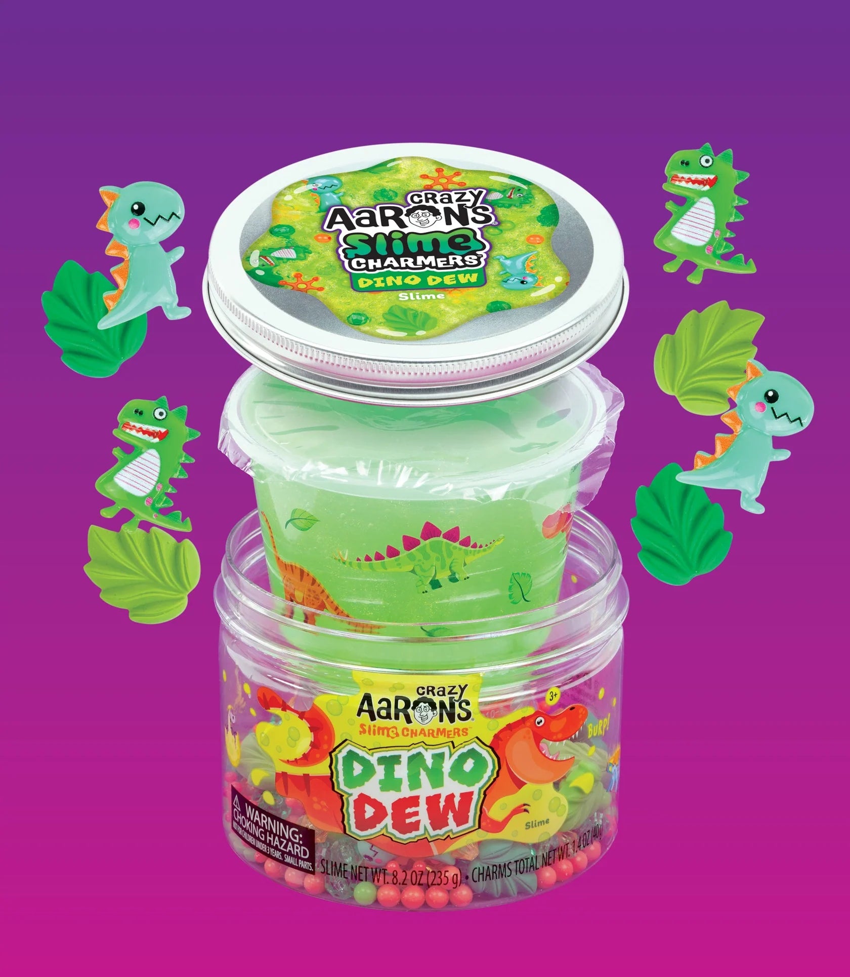 Green slime with dinosaur and leaf shaped charms and jar.
