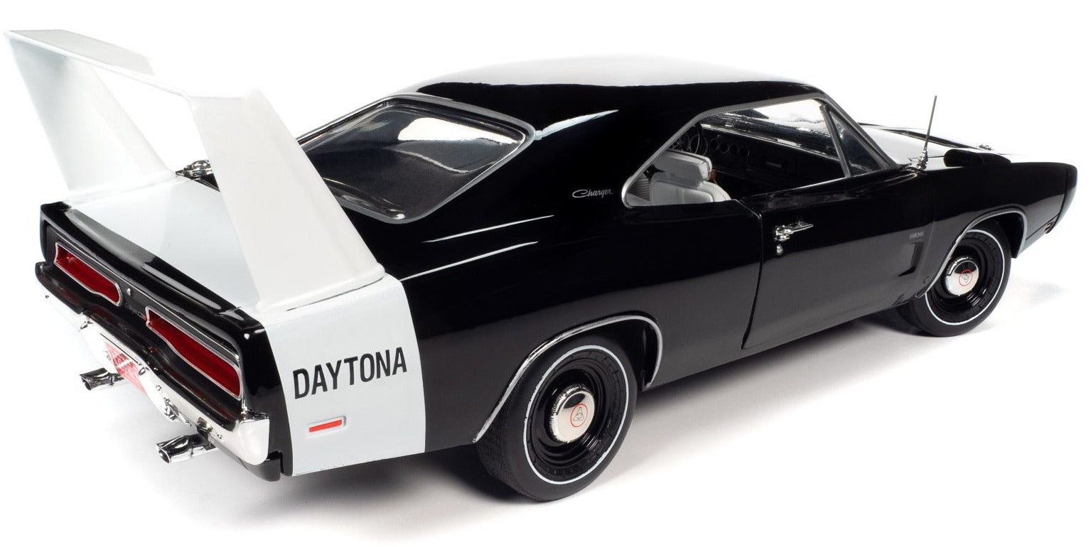 1/18 scale model of a 1969 Dodge Charger Daytona in black with white tail stripe.