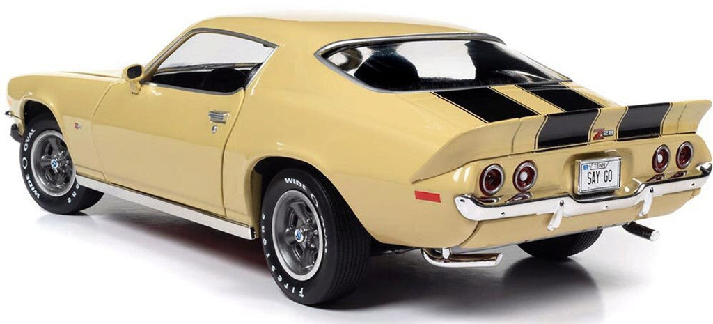 A 1/18 scale model of a 1972 Chevy Camaro Z/28 RS in cream yellow with black stripes.