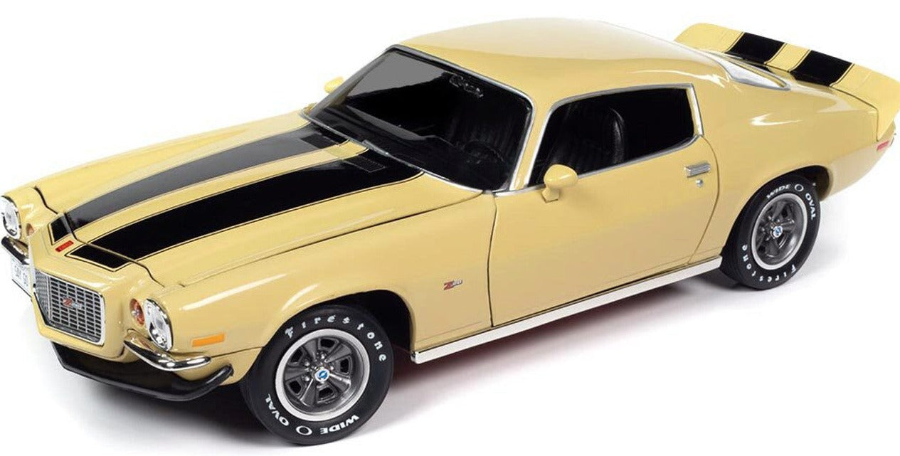 A 1/18 scale model of a 1972 Chevy Camaro Z/28 RS in cream yellow with black stripes.