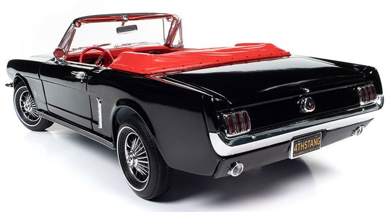 A 1/18 scale model of a Ford Mustang open convertible in Raven Black with Red Interior.