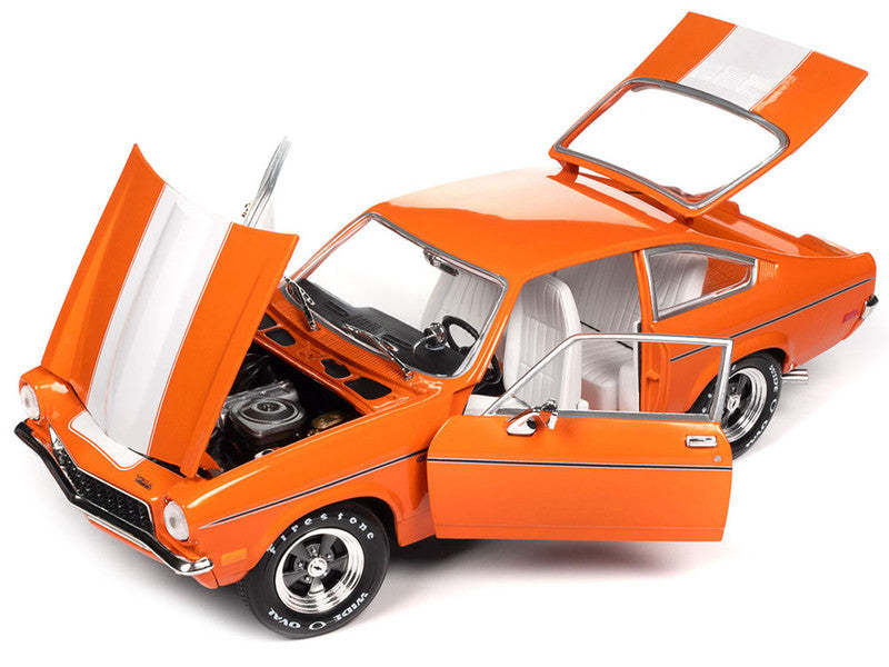 1/18 scale diecast model car of 1973 Vega GT in Orange showing opening hood, doors, and trunk.