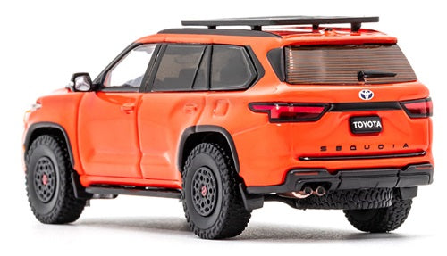 Model car of a 2023 Toyota Sequoia TRD Pro in orange.