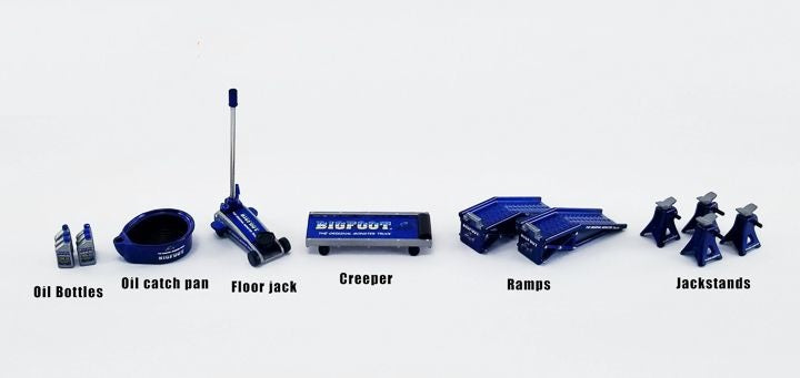 Blue "Bigfoot" branded car accessories including floor jack, creeper, ramps, jackstands, oil bottles, and oil catch pan.