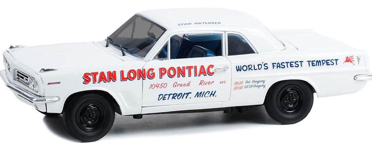 1/18 scale model of a 1963 Pontiac Tempest in white with blue and red words on the sides and black wheels.