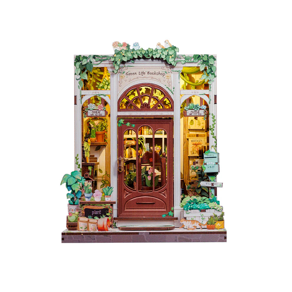Assembled Green Life Bookshop book nook kit.  Model is a city building covered in greenery.