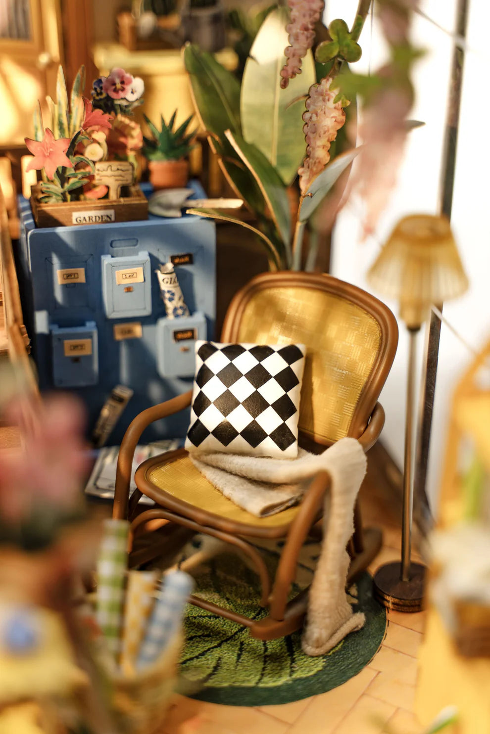 Close up of rocking chair and details in Garden House book nook kit.