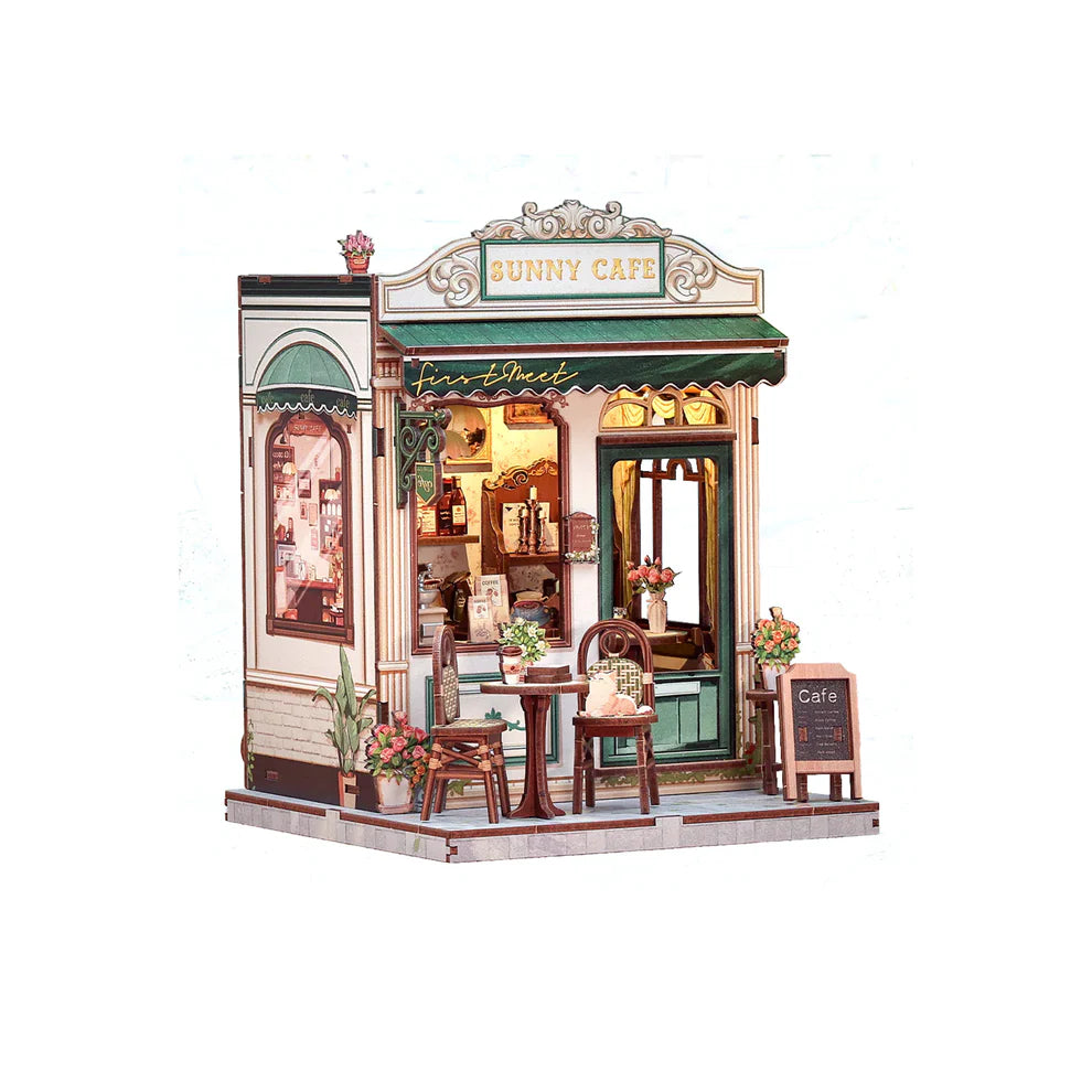 Model of a cafe named 'Bunny Cafe' with interior lights on a white background