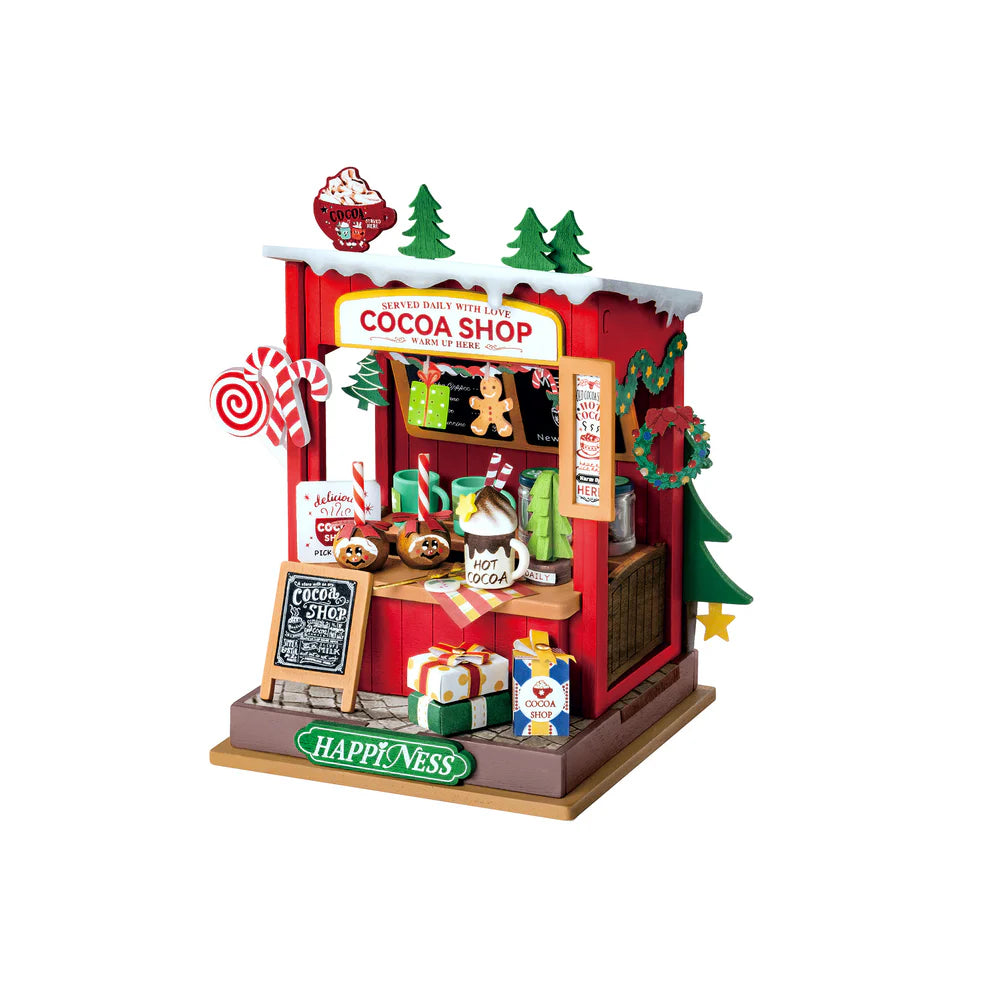 Assembled Cocoa Shop Mini kit shows a red stand decorated for Christmas with hot cocoa mugs on the counter.