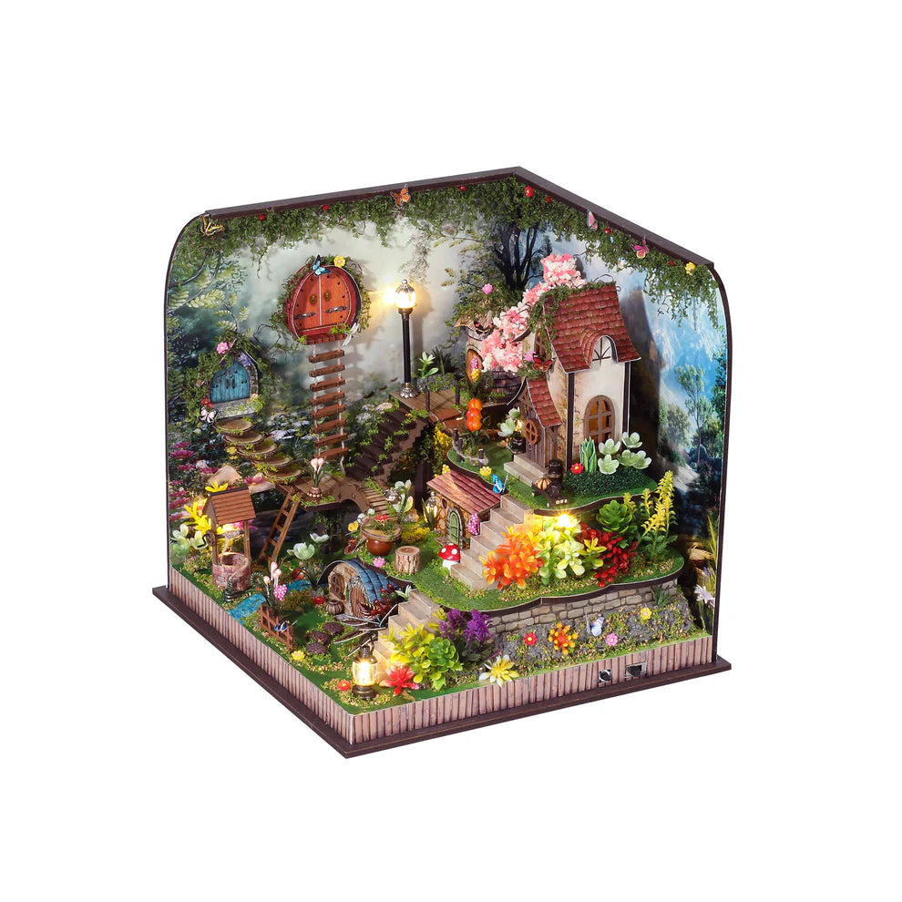 Miniature kit of a tiny fairy village with small doors, stairs, flowers, and working light.