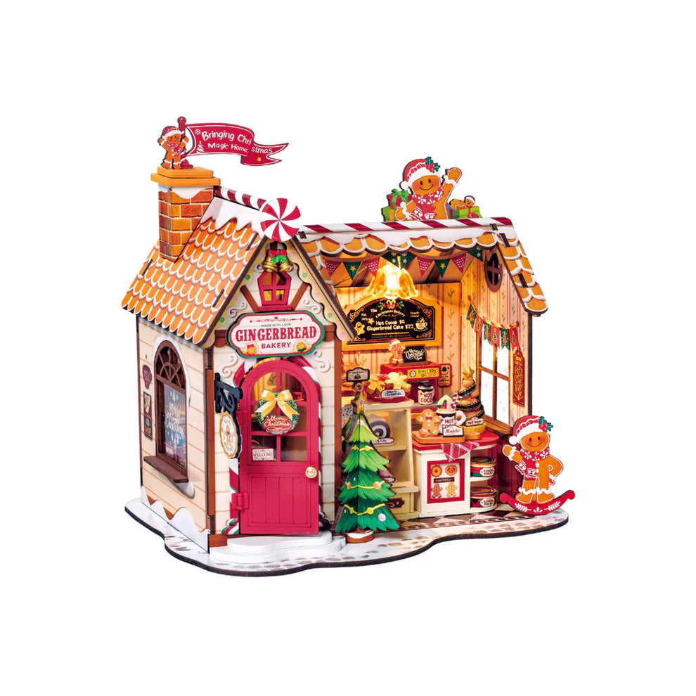 Gingerbread house model with decorative elements on a white background