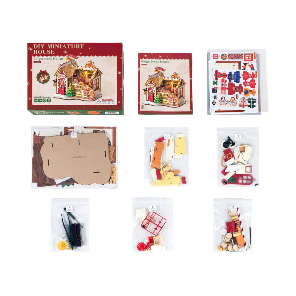 Miniature house kit with packaging and components on a white background