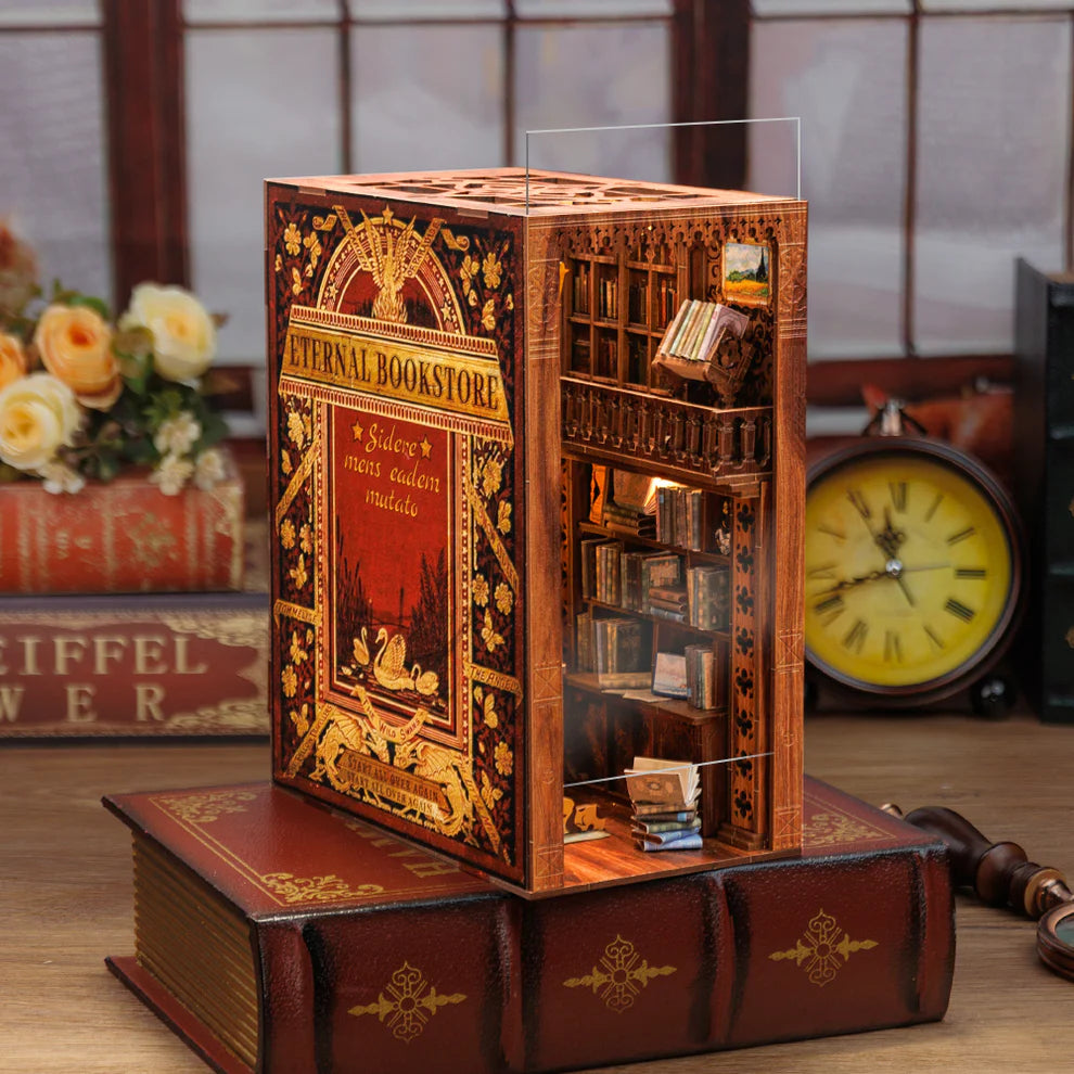Decorative bookshelf model with book design, featuring 'Eternal Bookstore' on a wooden surface.
