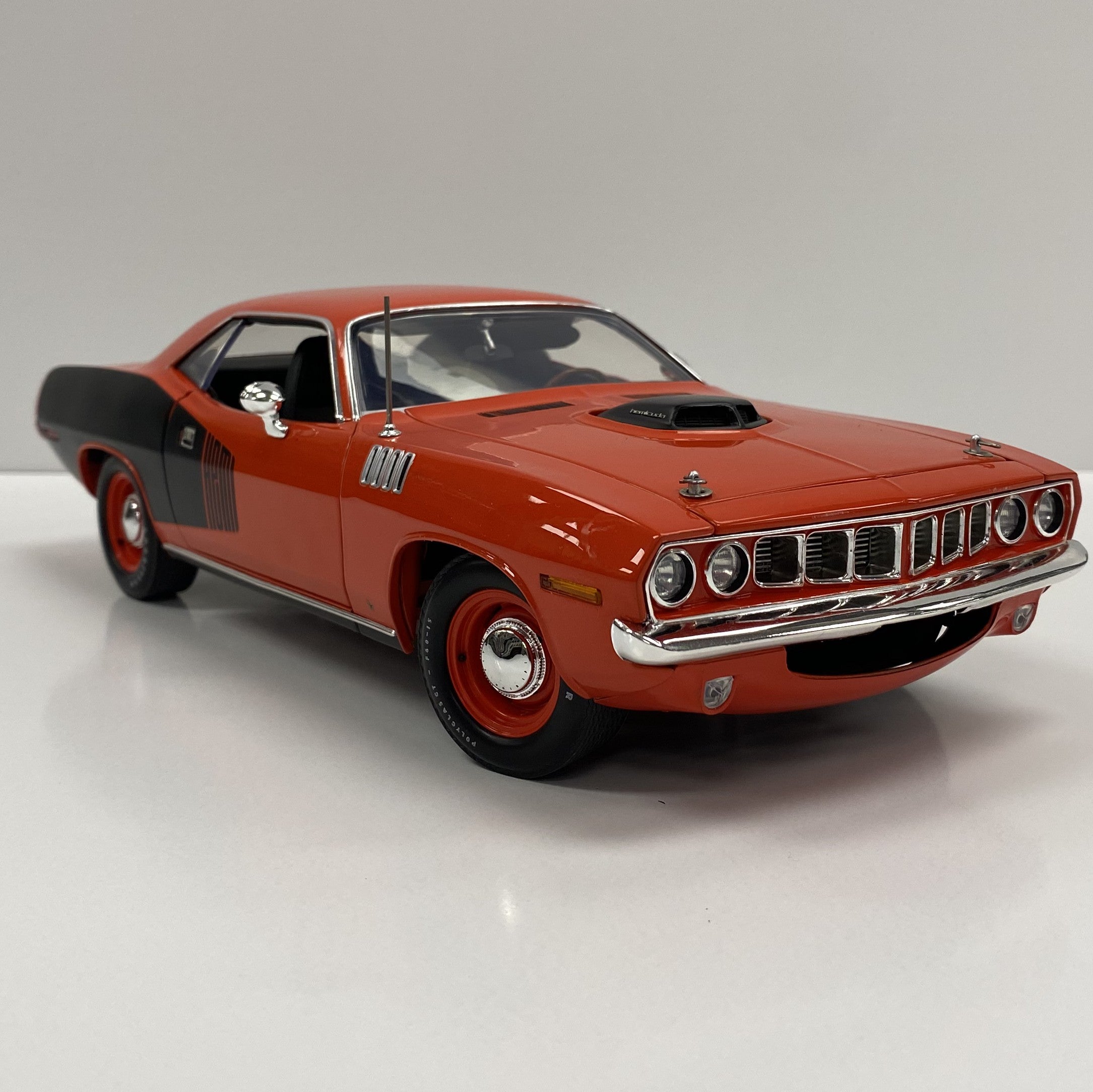 Scale model of 1971  Hemi Cuda in Tor Red with black billboard.