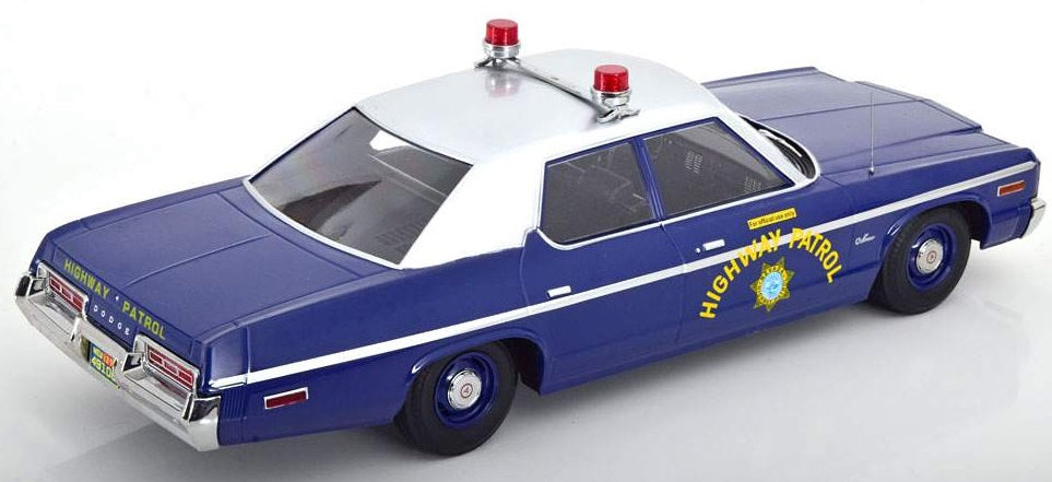 A 1/18 scale model of a 1974 Dodge Monaco Nevada Highway Patrol car in blue and white color.