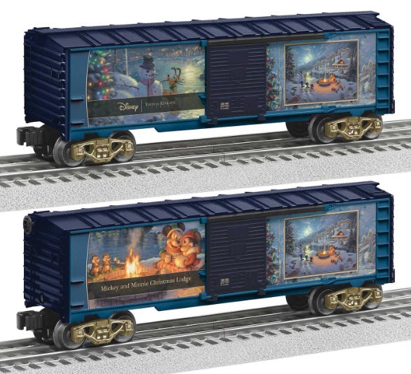 A blue boxcar with Christmas-themed decorations, featuring Mickey Mouse and Minnie Mouse graphics, designed by Thomas Kinkade Studios.