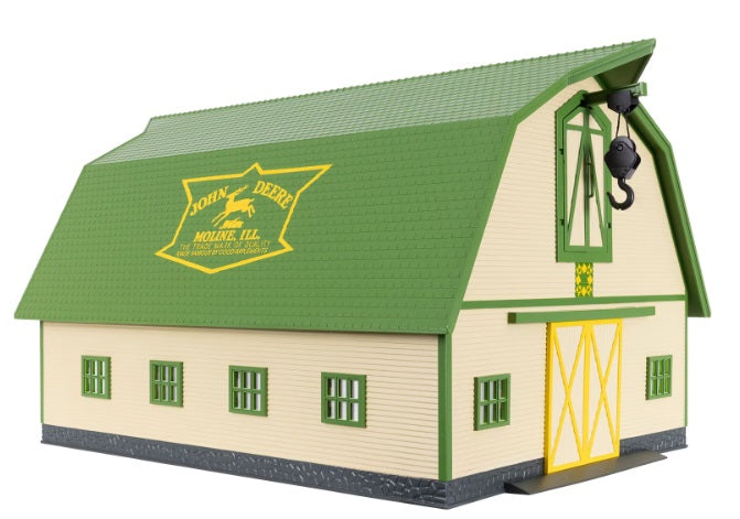A green John Deere barn toy with a hay crane, designed for O gauge model railways.
