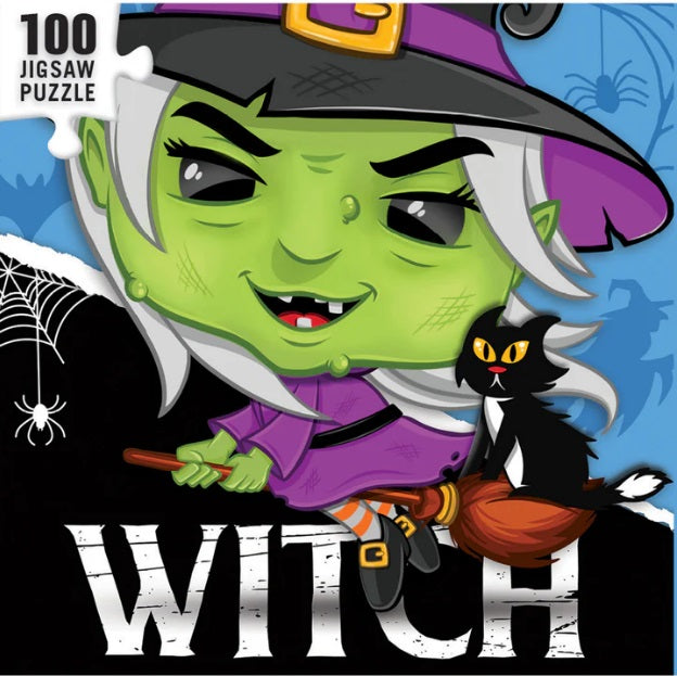 Puzzle box art depicting a green witch wearing a purple dress riding a broom with a black cat.