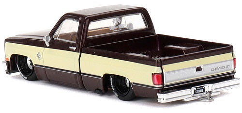 1/64 scale model of a two tone Chevy Silverado with lowered chassis.