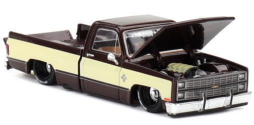 1/64 scale model of a two tone Chevy Silverado with lowered chassis.