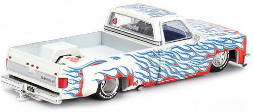 1/64 scale model of white Chevy Silverado with lowered chassis and red and blue flames.