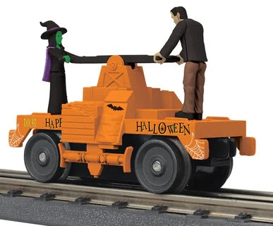 Operating O scale hand car with Halloween theme.