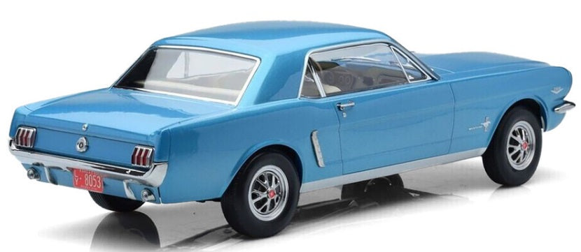 A 1/18 scale model of a 1965 Ford Mustang Hard Top Coupe in blue color.