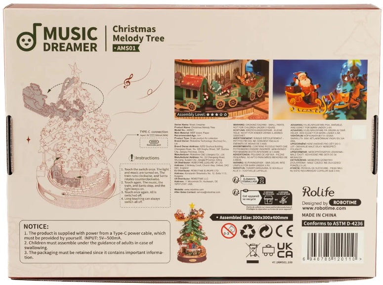 Back of model kit package of a Christmas Tree with Santa flying around in his sleigh