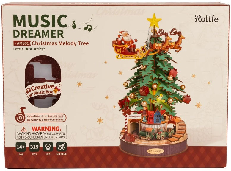 Model kit package of a Christmas Tree with Santa flying around in his sleigh