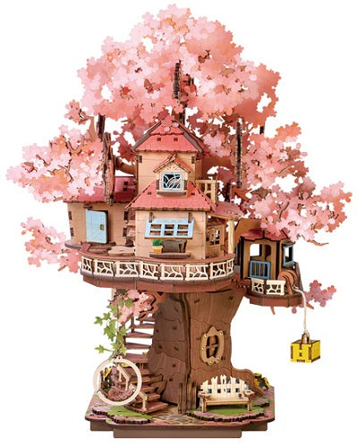 Treehouse model with cherry blossom branches on a white background