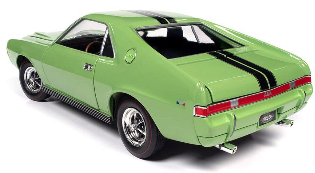 A 1/18 scale diecast model of a green 1969 AMC AMX  with two black stripes down the roof and trunk.