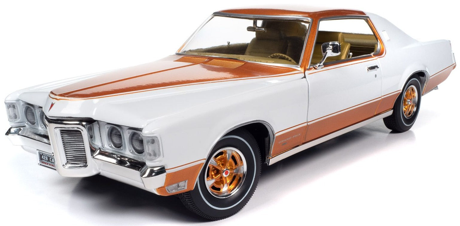 1/18 scale model of a 1969 Pontiac Grand Prix Royal Bobcat in white with gold details.