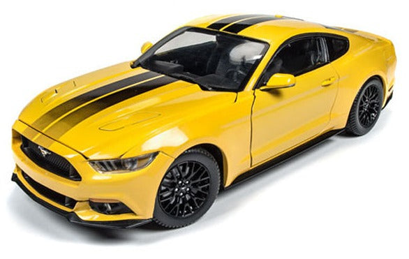 A 1/18 scale diecast model of a 2016 Mustagng GT yellow in color with 2 black stripes down the center.