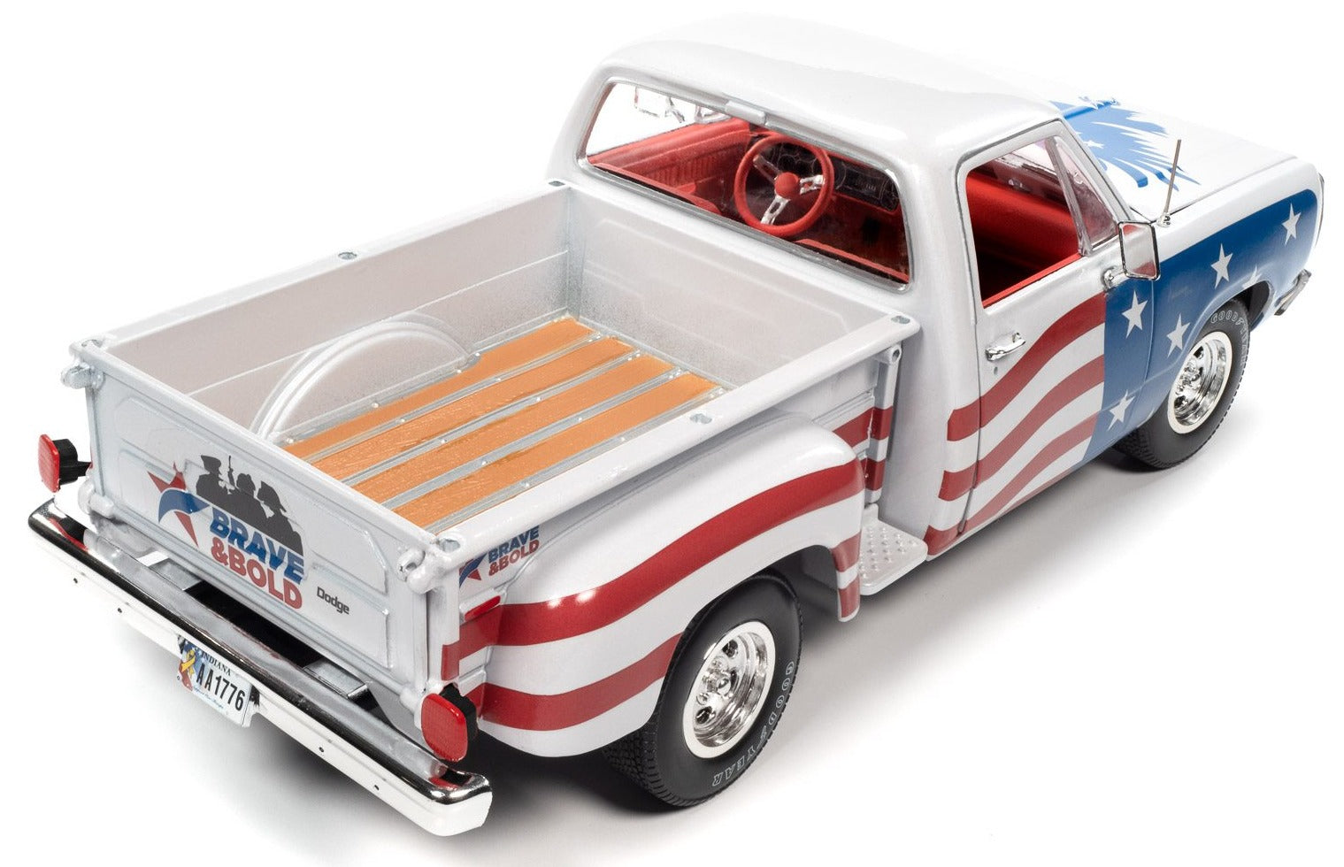 A 1/18 scale diecast model of 1980 Dodge Step Side Pick up truck with Patriotic red, white, and Blue paint scheme.