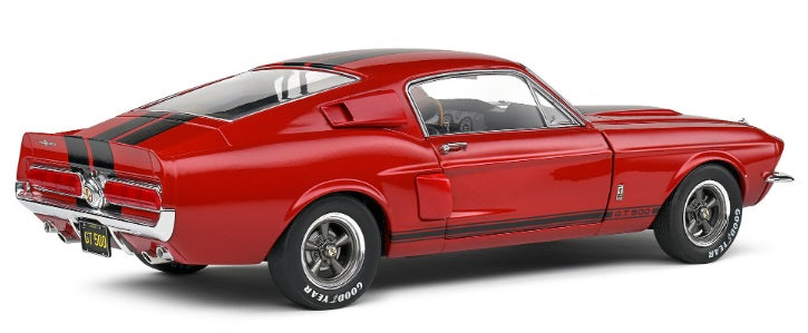 1/18 scale model of a red Shelby GT500 with black stripes.