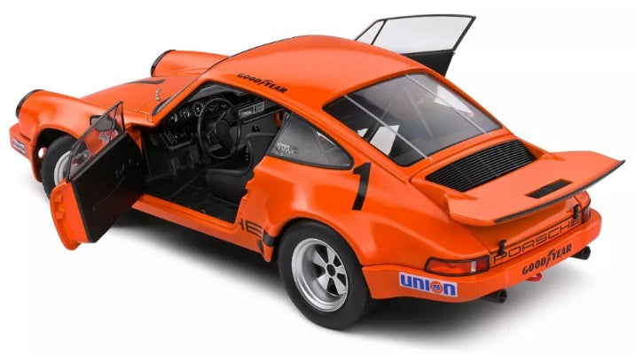 1/18 scale model of a Porsche 911 IROC in orange with doors open.