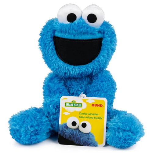 Blue plush toy with large white eyes and a big smile with a yellow tag.