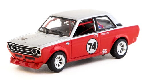 Model car of a Datsun 510 in red and white with the number 74 on the door.