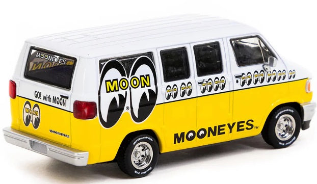 1/64 scale diecast yellow and white Dodge Van with Mooneyes branding.