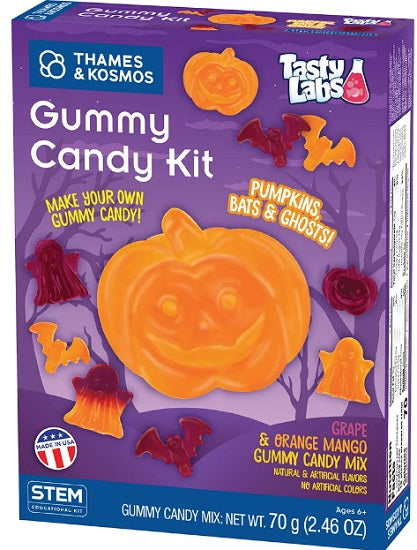 Thames & Kosmos Tasty Labs Gummy Candy Kit box, featuring a purple packaging design with illustrations of a pumpkin, bats, and ghosts, labeled grape and orange mango gummy candy mix.