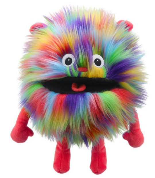 Round fuzzy puppet with rainbow colored fur and red arms and legs.