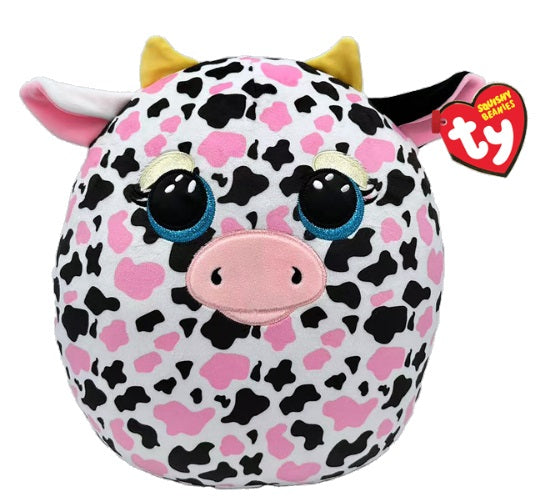 Round cow with pink and black spots and a red heart shaped tag.