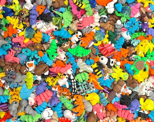 Assorted 3D printed animal shaped toys.
