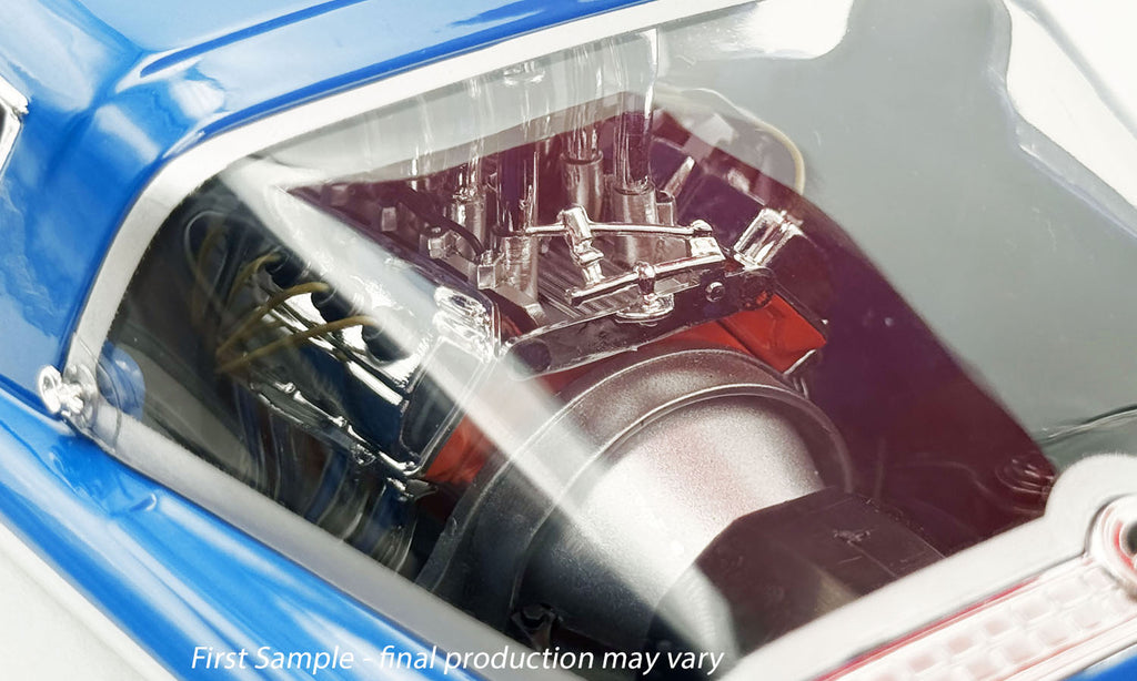 Close-up of a car engine through window.